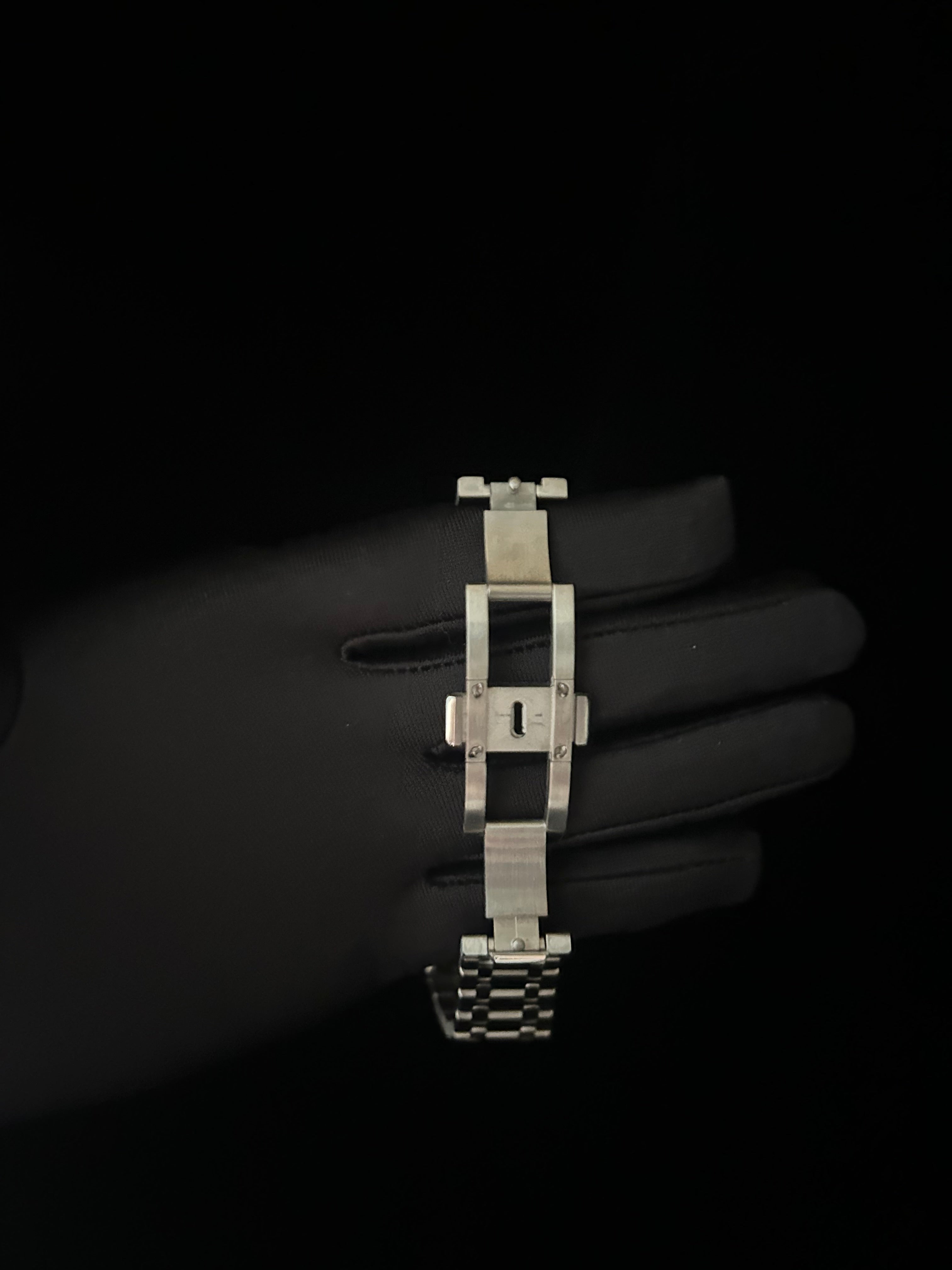 Silver bracelet on a dark background