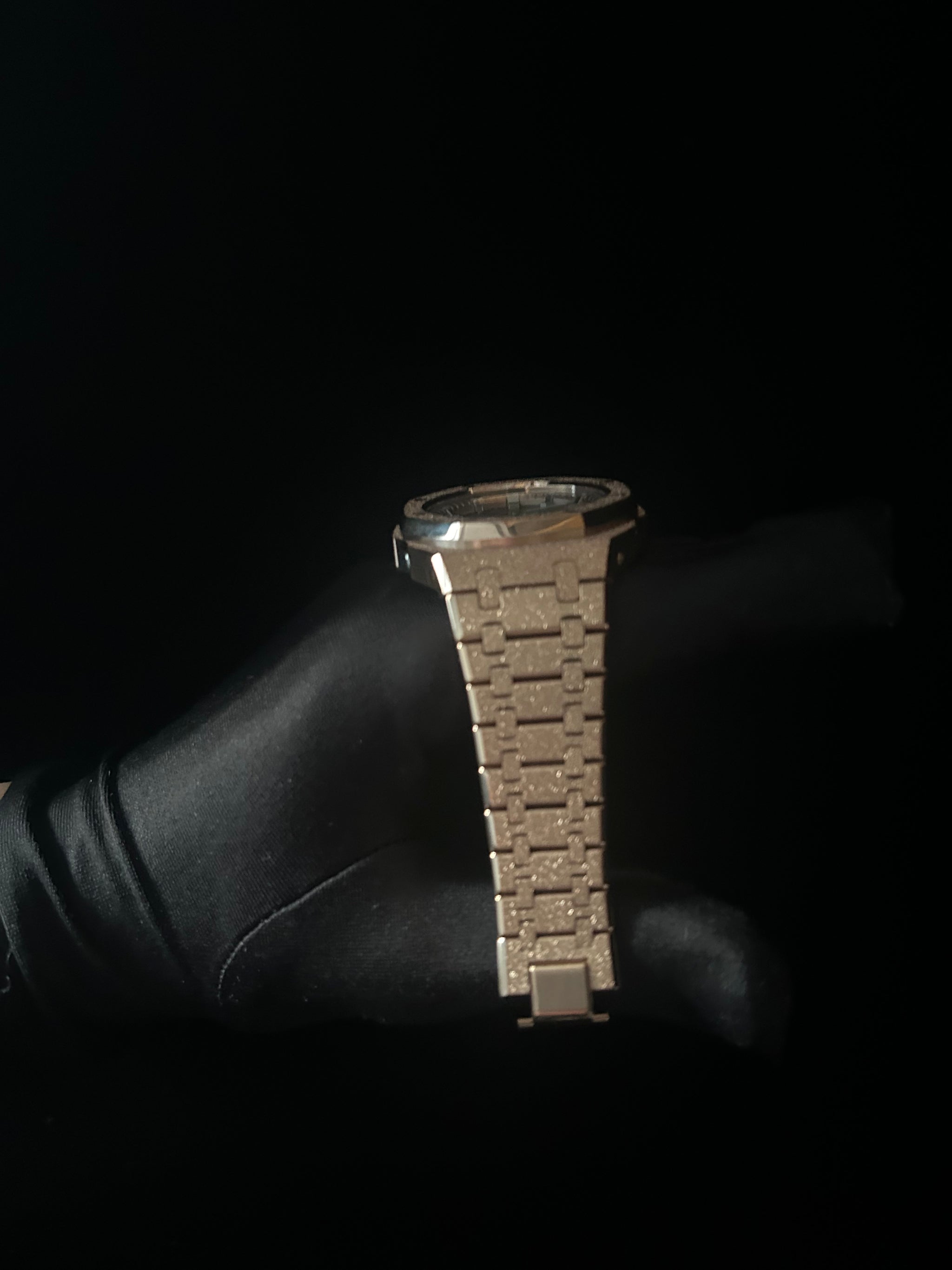 Metallic bracelet on a black background