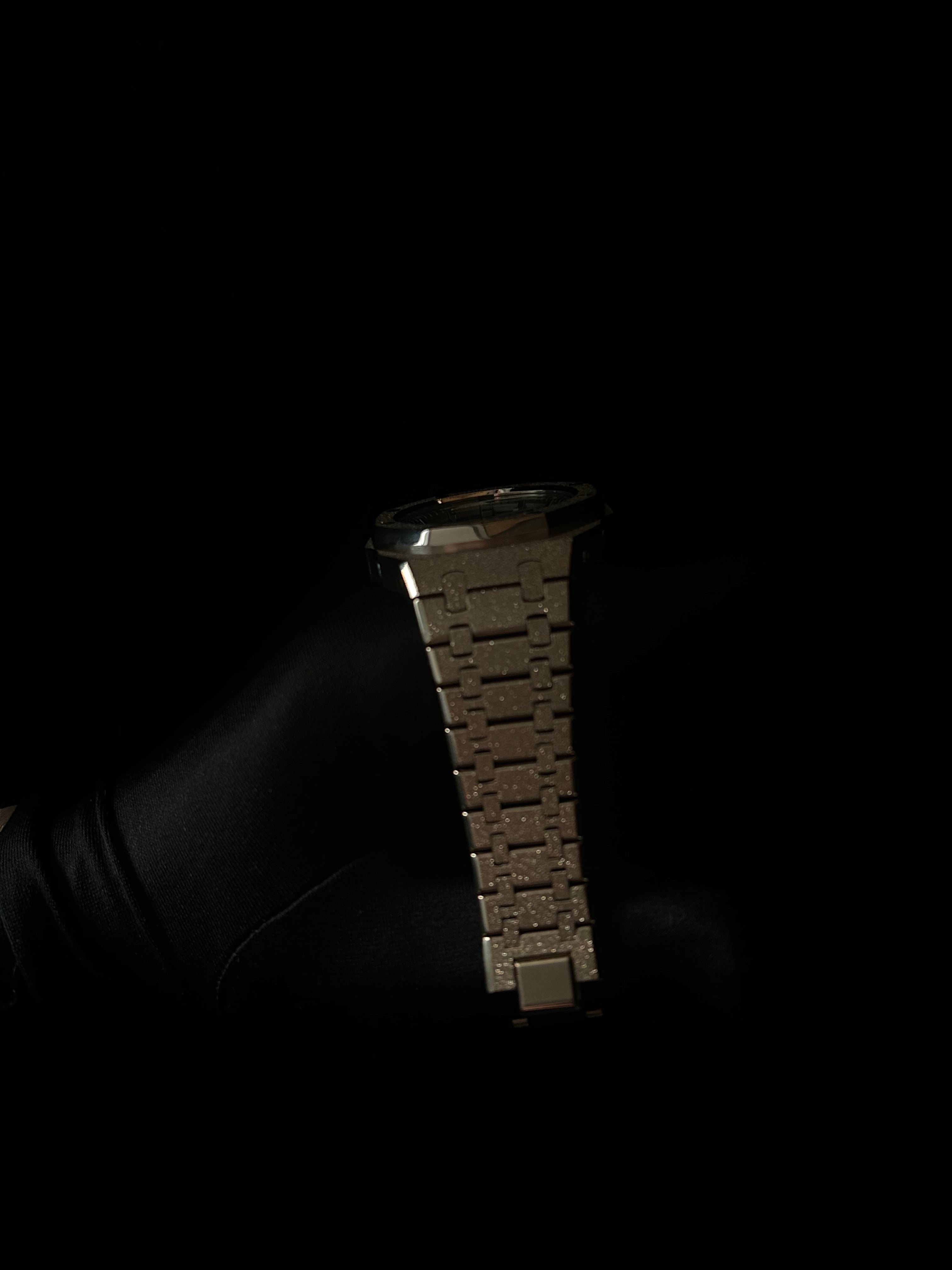 Metallic bracelet on a black background