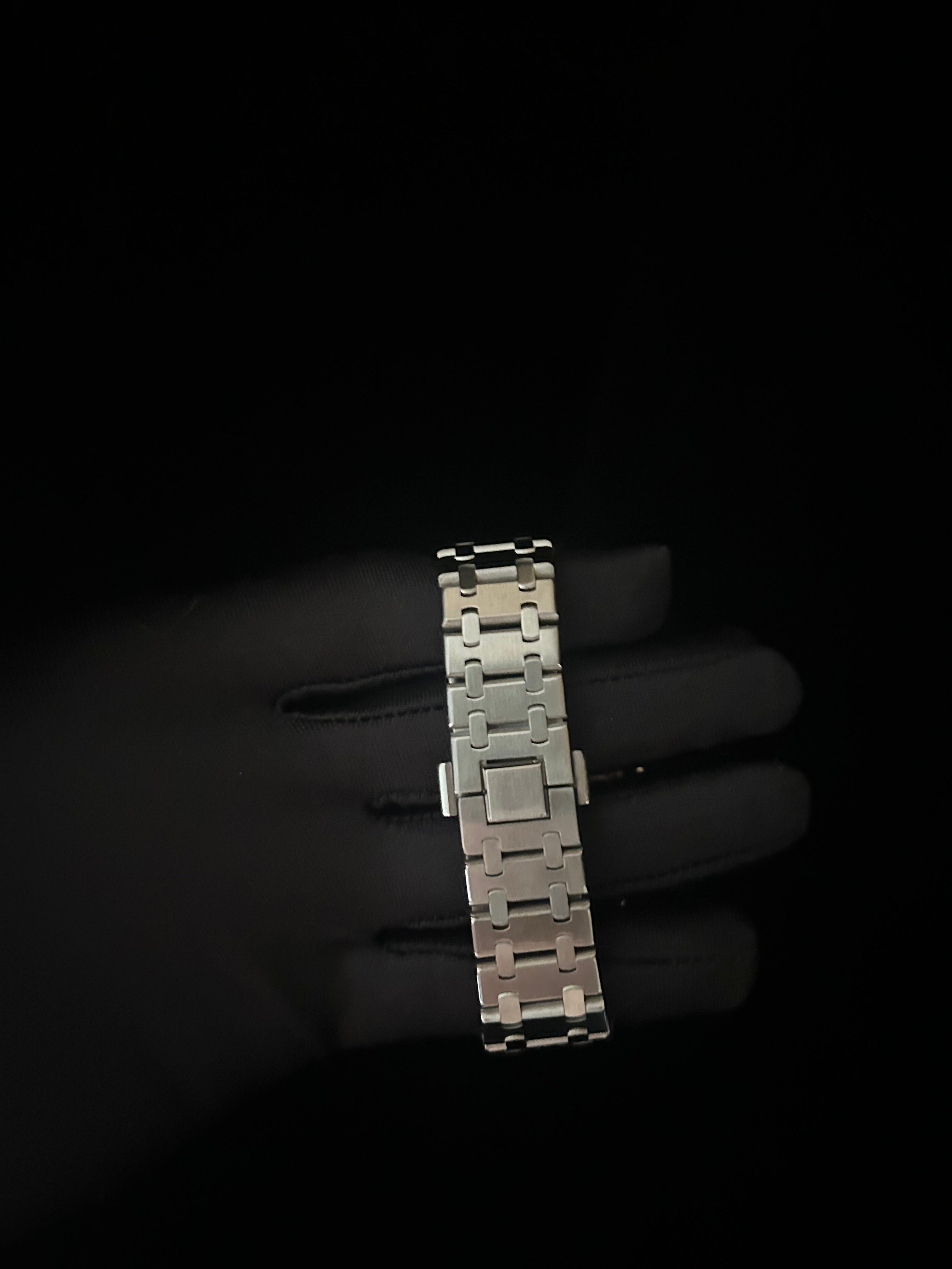 Metallic bracelet on a dark background