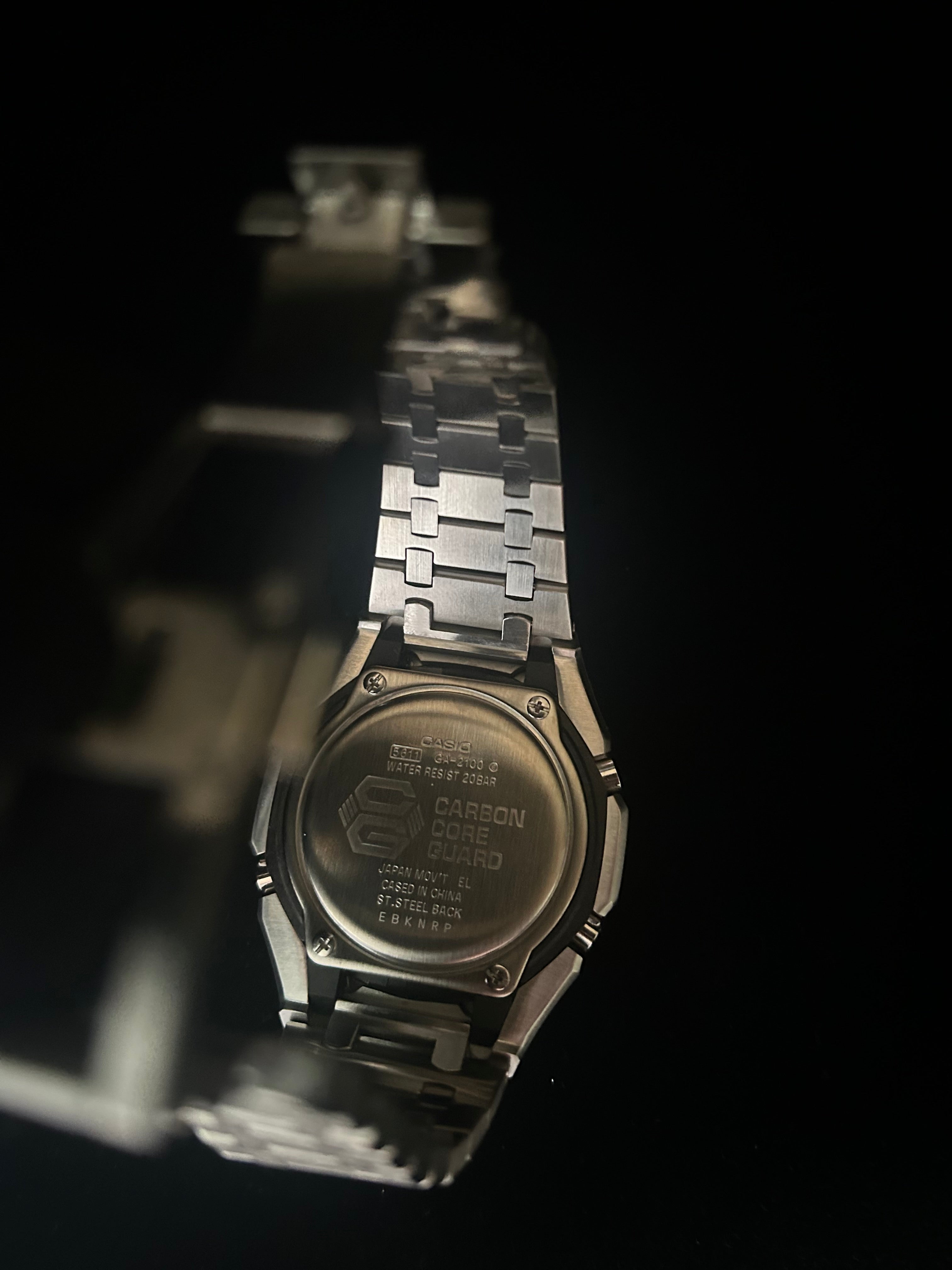 Metallic watch with a dark background