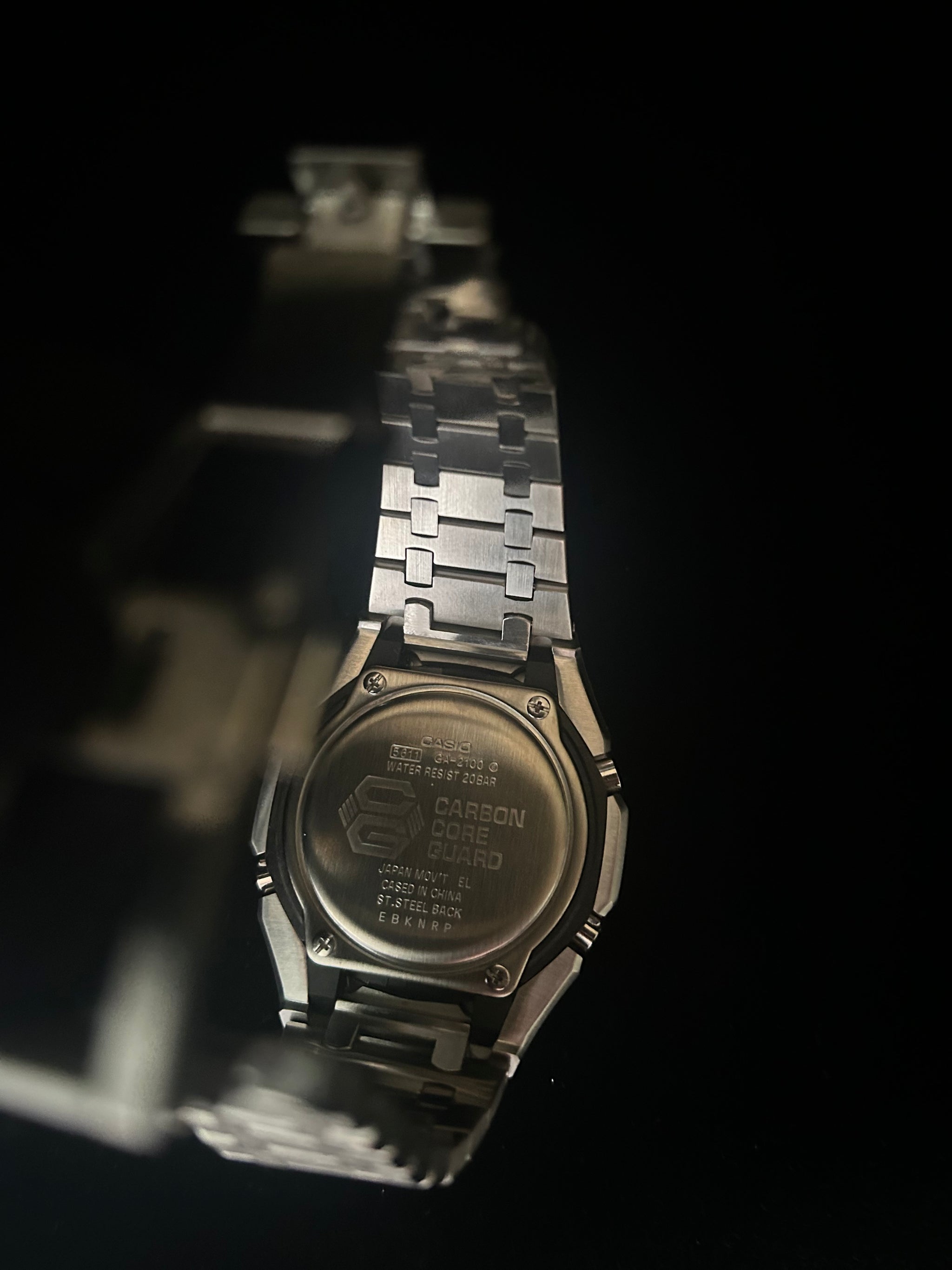 Metallic watch with a dark background