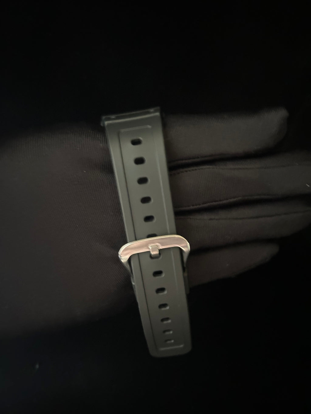 Watch strap with buckle on a black background