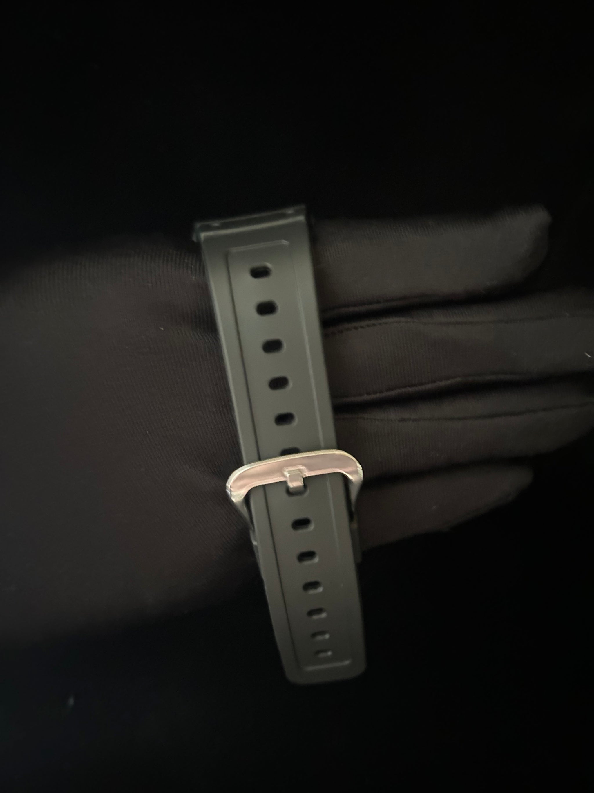Watch strap with buckle on a black background